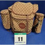 A GUCCI Camel and Burgundy Double G Monogrammed Canvas Backpack with Leather detail GUCCI Script