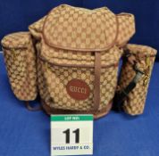 A GUCCI Camel and Burgundy Double G Monogrammed Canvas Backpack with Leather detail GUCCI Script