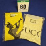 A Set of Two GUCCI T-Shirts:- - A Cream Cotton with Printed Black GUCCI Double G Interlocking