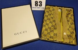 A GUCCI Gold Lurex Wool Cardigan with Double G Logo depicted all over in Black Crystal Diamante,