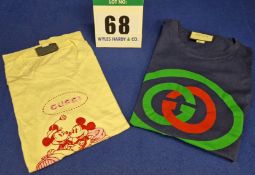 Two GUCCI T-Shirts:- - A Dark Blue Cotton Jersey Round Neck with Green and Red Interlocking Double G