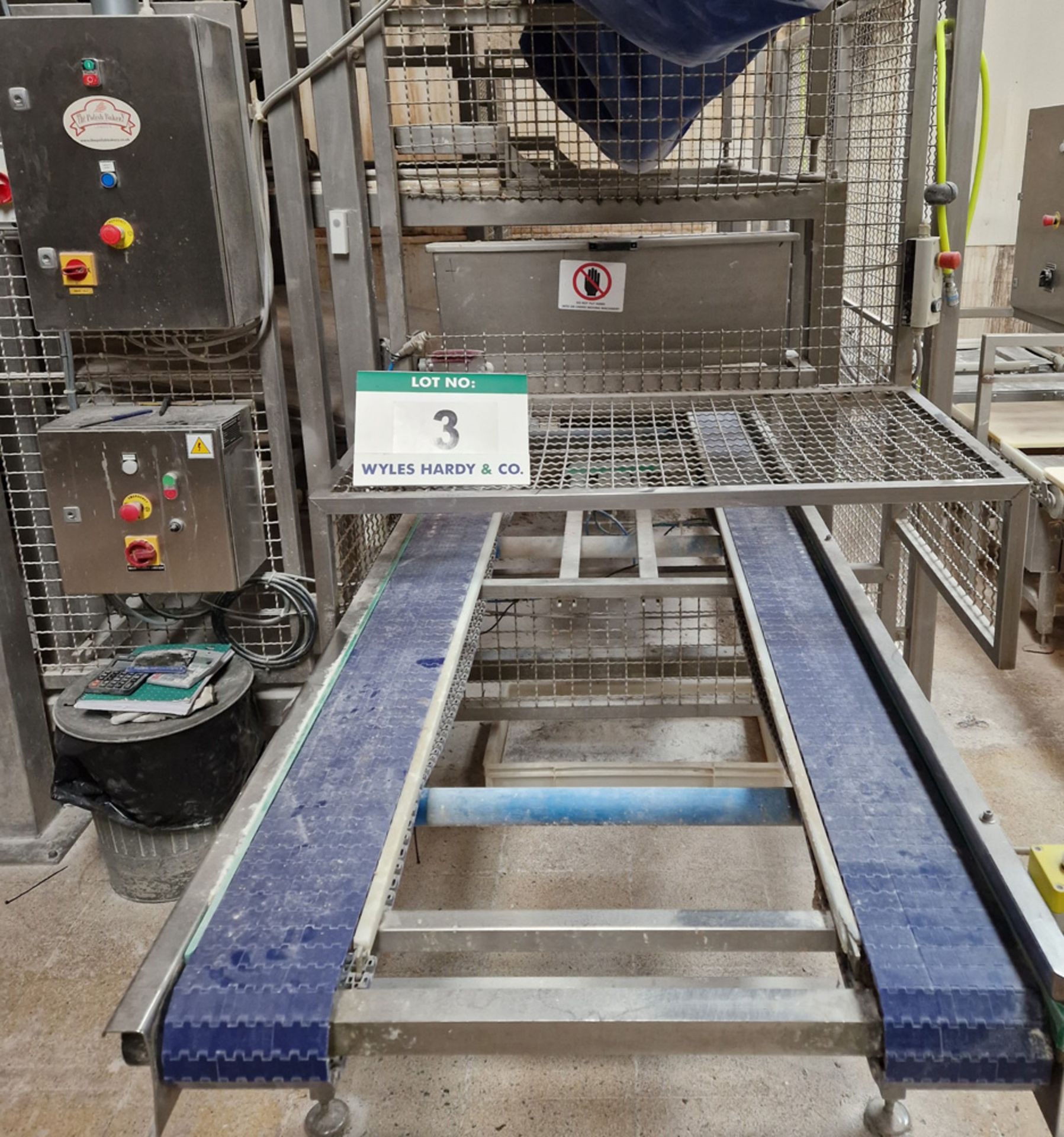 A WP HATON Bakerlink Automated Peel Board and Oven Rack Loading/Unloading Conveyor System Serial No.