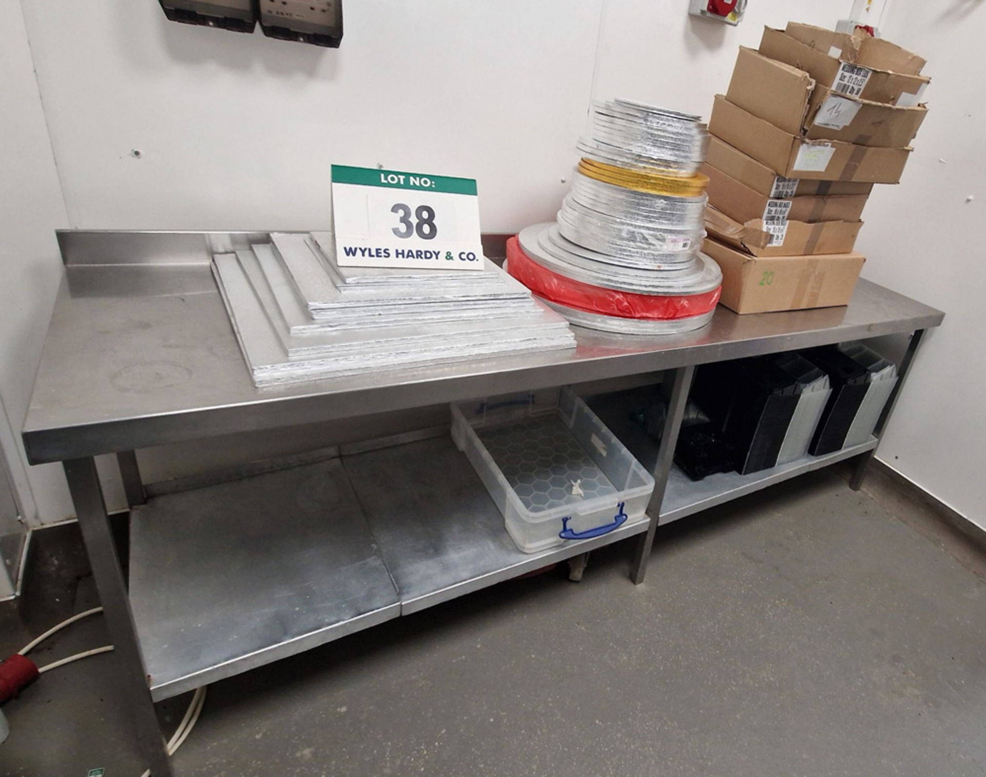 A Stainless Steel Preparation Table with fitted Lower Shelf and A Quantity of Cake Boards (As