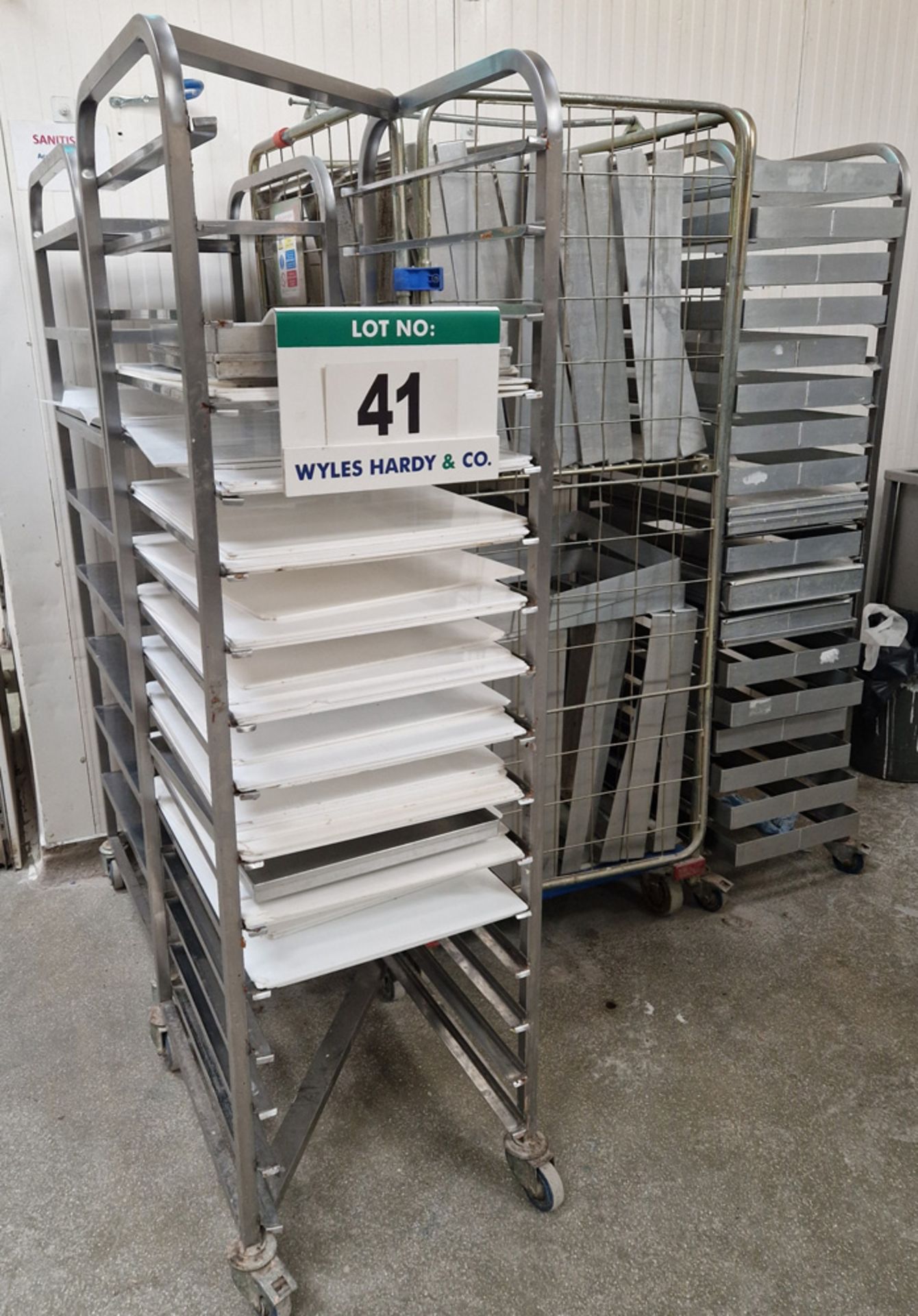 Three Various Stainless Steel Tray Trolleys and A Cage Trolley with A Quantity of Various