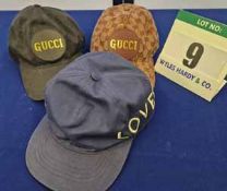 Three GUCCI Baseball Caps:- - A Black Embossed Double G Logo Canvas Cap with Leather GUCCI Logo