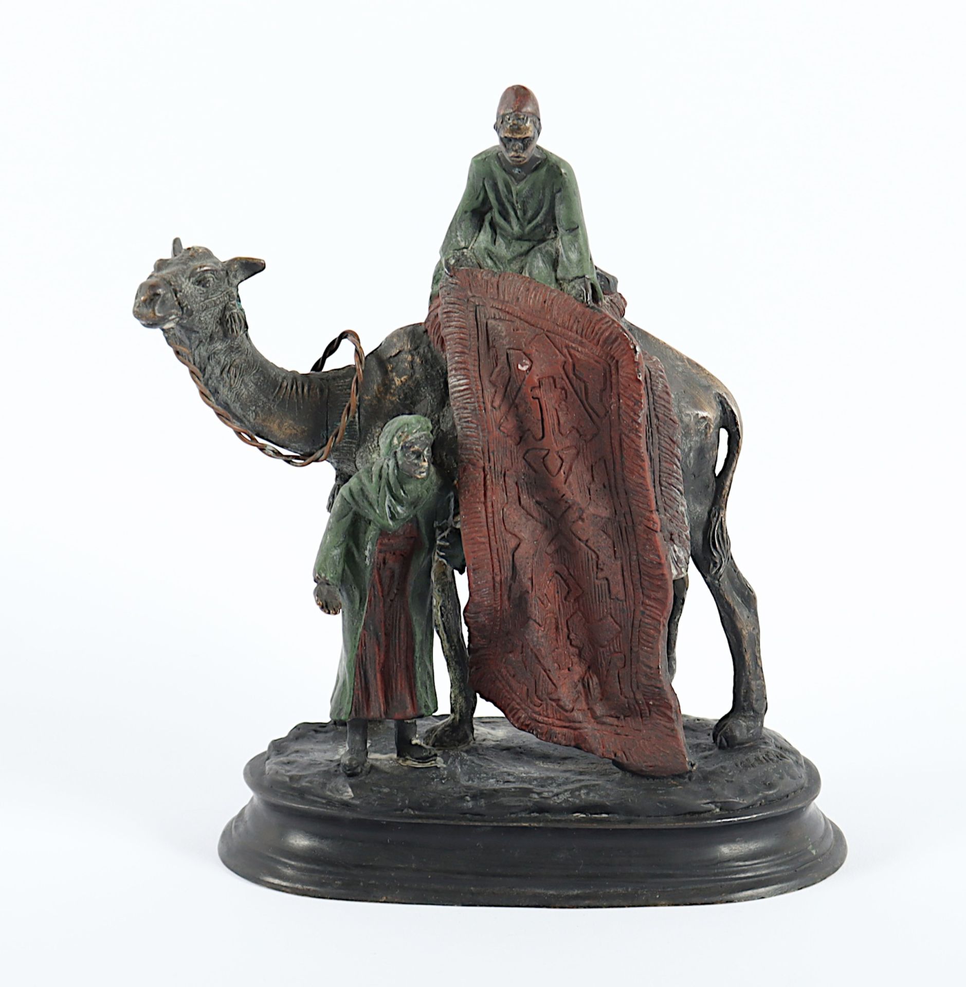 KAUBA, Carl (1865-1922), nach, "Beduine auf einem Kamel einen Teppich anbietend", Bronze, bemalt, H
