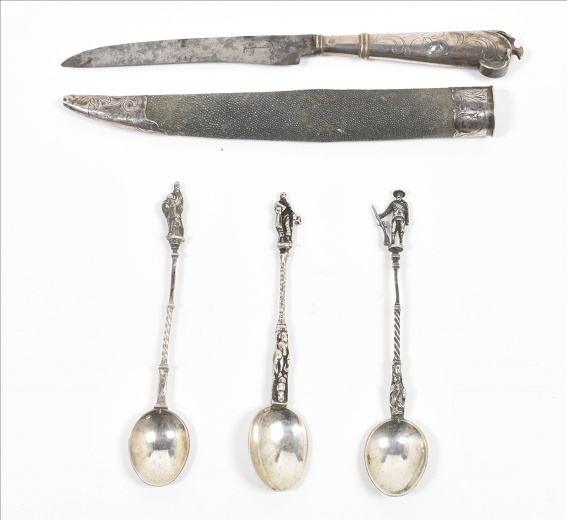 Four silver pieces of cutlery