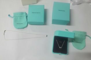 Two Tiffany 925 silver "coffee bean" pendants on silver chains, one with presentation box with the