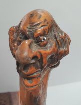 Antique gentleman's club, the head carved into an old mans head