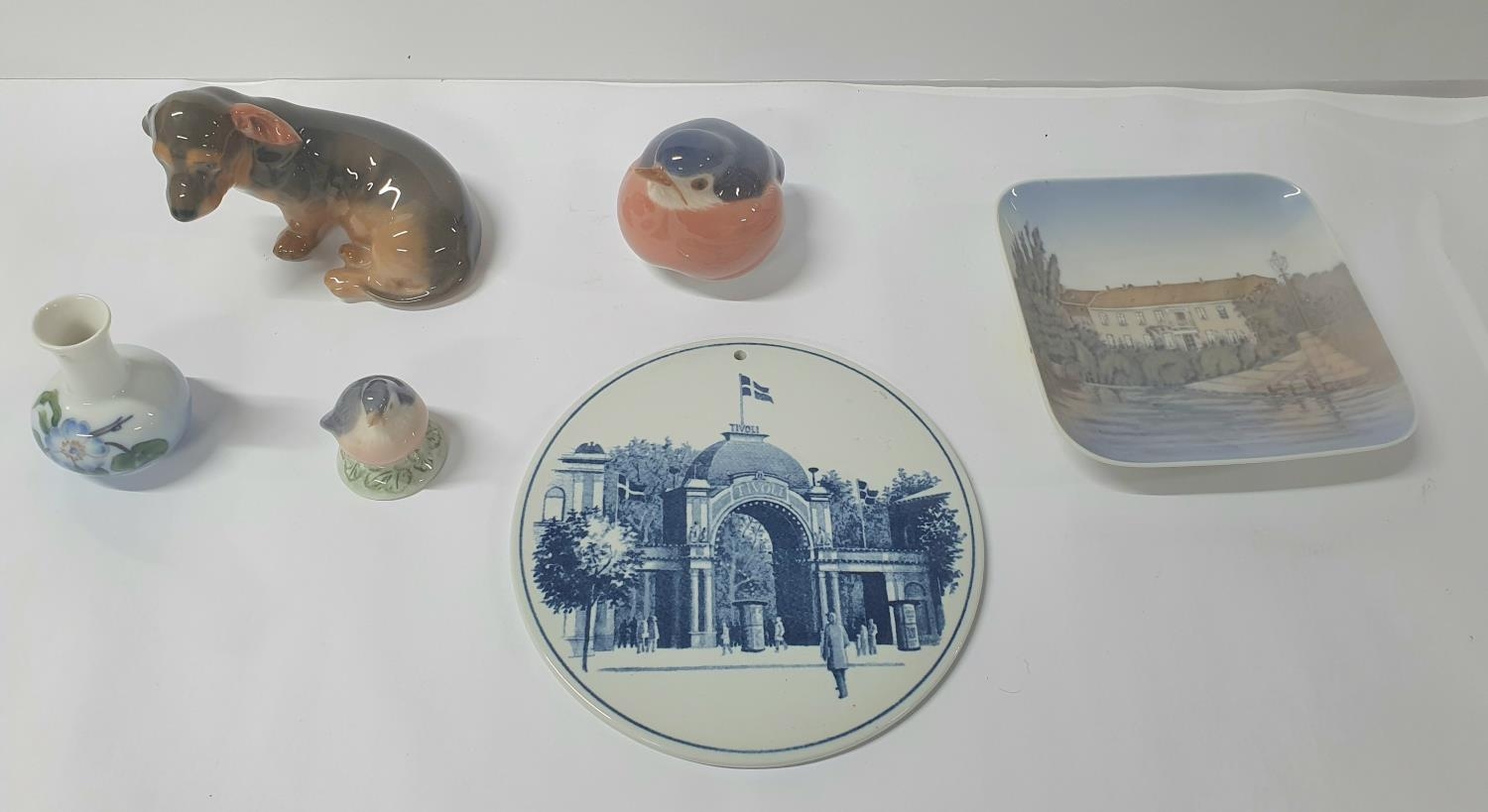 Collection of six pieces of Royal Copenhagen including a Dachshund, 2 small birds, pin dish and