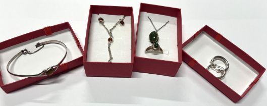 Silver green stone pendant on a chain with earings along with silver and amber necklace with