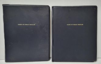 Two black coin albums both containing "coins of Great Britain" sets