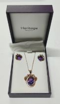 A necklace, pendant and earring set with grape surrounds marked 14K