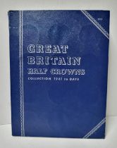 Blue coin album containing GB half crowns (1941 - 1967)