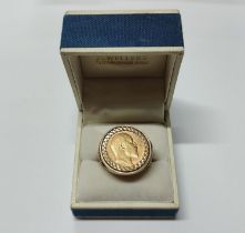 A George IV 1908 full sovereign situated in a 9ct. yellow gold shank with George and the Dragon