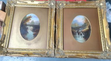 Pair of Victorian Welsh river bridge scenes both signed C LAMBERT and both in gilt oval mounts and