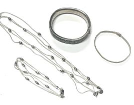 2 hallmarked silver bangles along with silver 3 strand necklace and bracelet