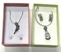 Silver flower pendant on chain with earings along with silver crystal bird nest pendant on chain and