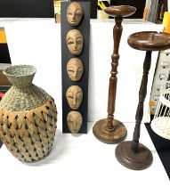 Mid 20th c wooden standing ash trays along with wicker vase and wall plaque with carved wooden faces