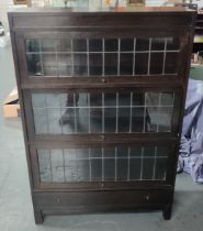 A mid-century Globe Wernicke-style barristers bookcase with drop and slide windows, glazed with