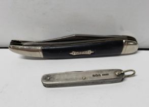 Sheffield 1924 silver pen knife stamped F.T & Co (25 grams) together with another, non silver "