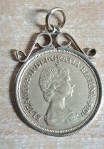 Queen Elizabeth II 1982 1/2 sovereign in a 9ct yellow gold pendant casing, 4.7 grams