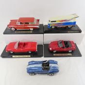 5 Diecast collector cars, 4 on stands