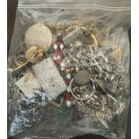 BAG OF MIXED UNSORTED JEWELRY / SOME SORT OF SILER BRICK INSIDE IT