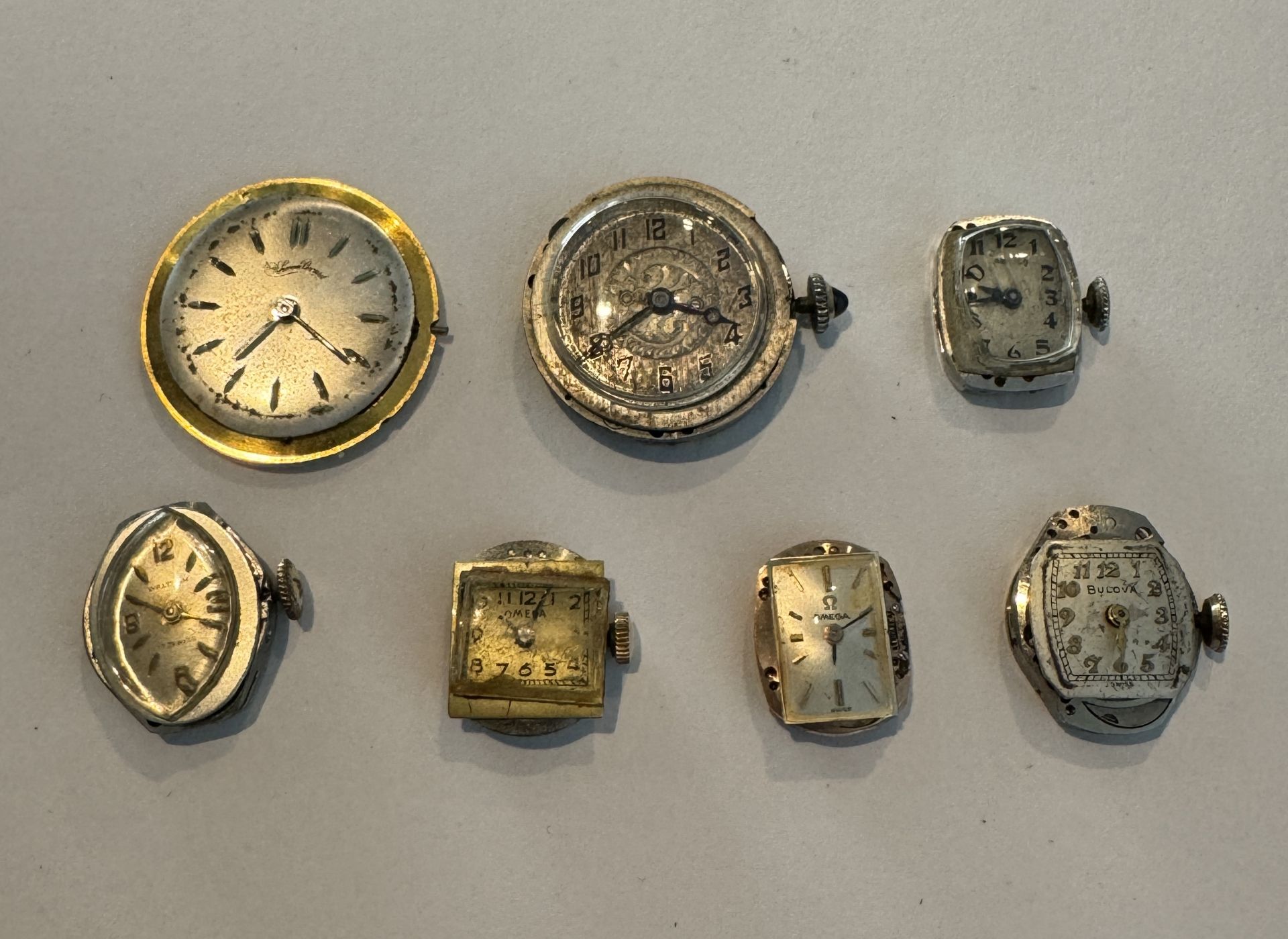 BULOVA, OMEGA, + OTHERS ORIGINAL WATCH MOVEMENTS