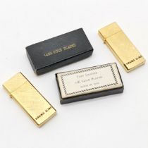 Pair Virginia slims 14k gold plated lighters in their original boxes 6cm x 3cm, in unused condition