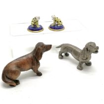 Pair of miniature porcelain dalmatian dogs with gold anchor marks (4.4cm diameter), carved German