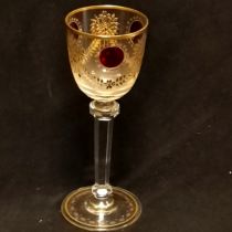 Antique continental cut glass wine goblet with gold filled etched decorationand red glass roundels