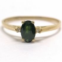 14ct marked gold diamond & dark green stone ring - size O & 1.1g total weight - SOLD ON BEHALF OF