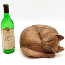 Hand carved model of a sleeping cat - 25cm across x 14cm high