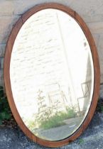 Oak framed oval bevel edge wall mirror,80 cm wide, 55 cm high, frame needs slight attention.