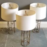 Set Of 3 Contemporary gold lamp bases with cream shades, lamp bases 56cm high, in used condition.