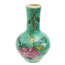 Chinese miniature vase with floral decoration on a blue green ground - 5cm high
