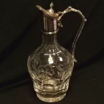 Cut glass claret jug with silver plated mounts with vine leaf decoration 27cm high - no obvious