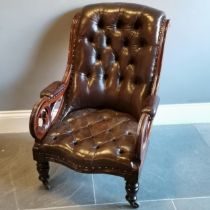 Antique mahogany framed leather upholstered button back library chair, with scroll arms in good