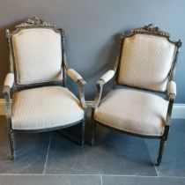 Pair of French painted salon chairs with a striped upholstery, in used condition, 62 cm wide, 64