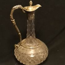 Victorian cut glass claret jug with silver plated mounts with pineapple finial and etched grape vine