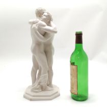 Composite figure of 2 males embracing with octagonal shaped base bearing marks ©PV - 40cm high