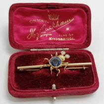Novelty gold (touch tests as 18ct) bar brooch with spider who has diamond eyes & blue stone body