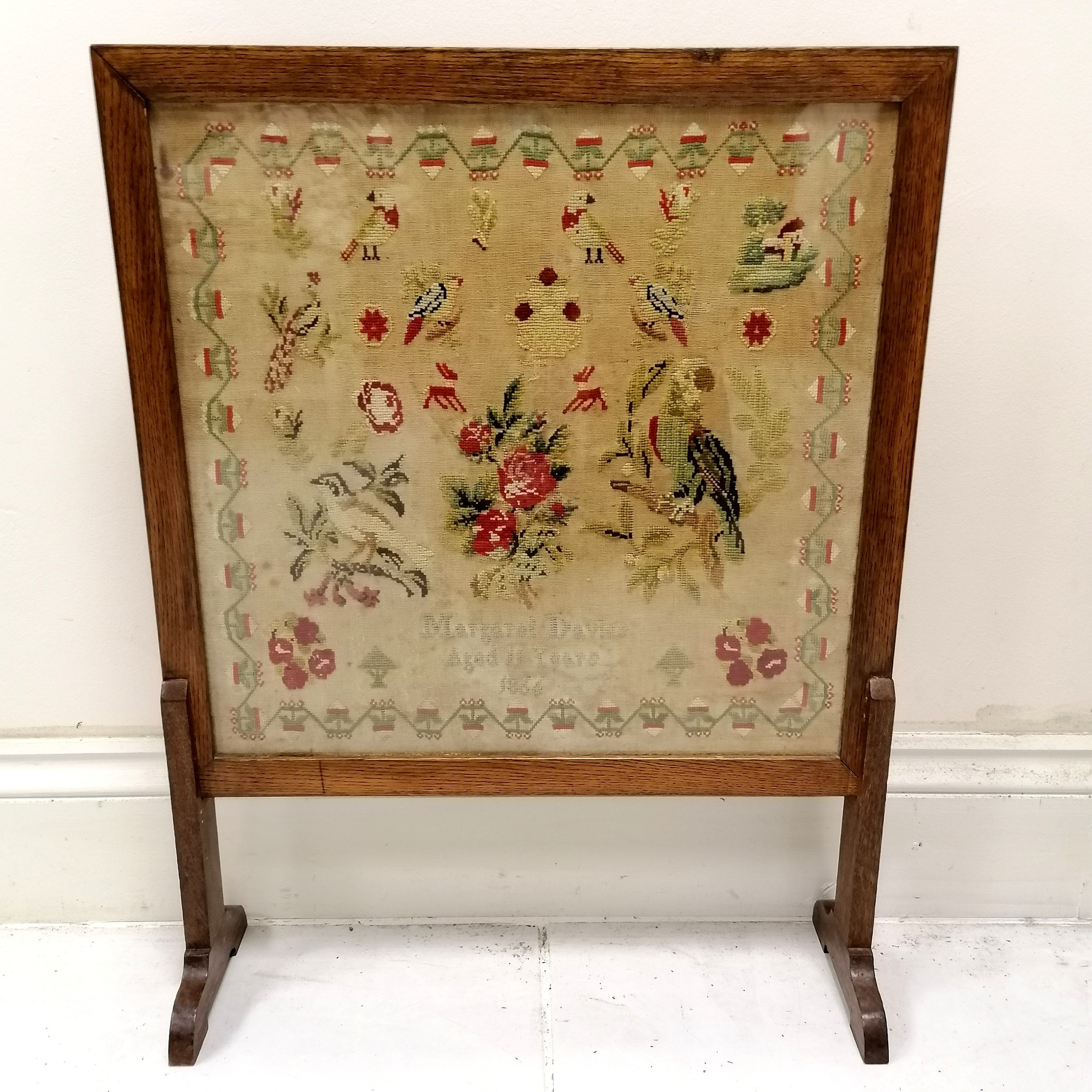 1866 tapestry sampler by Margaret Davies (aged 11) in a later firescreen stand - 72cm high x 55cm