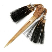 Antique New Guinea Cassowary bone ceremonial dagger with string, bead and feather detail 31cm long.