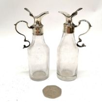 Pair of antique Georgian silver topped miniature ewers - 11cm high & 1 has chip to glass base