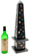 Large black marble obelisk with inlaid semi precious stones including lapis lazuli, amethyst,