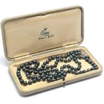 Double strand of black Tahitian / South Seas pearls with a 9ct white gold diamond set Lotus