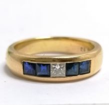 18ct marked gold sapphire (0.75 cts) & diamond (0.13 ct) set band ring - size P & 6.9g total weight
