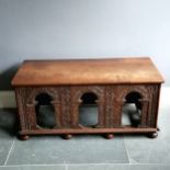 Antique oak low sideboard with arched detail to the front on bun feet